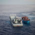 Illegale Migranten auf einem Boot im Mittelmeer. Bild: UNHCR/A. D’Amato